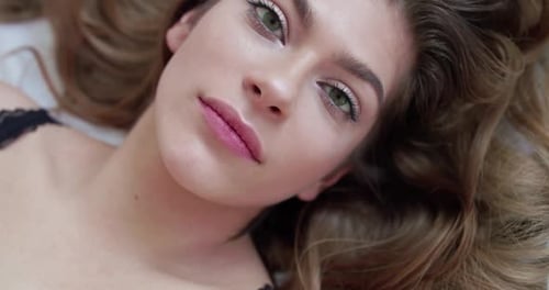 Young Adult Woman Lying Down Relaxed Close Up