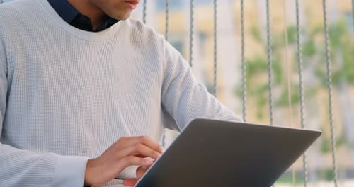 Male Commuter Using Laptop in Office Premises 4k