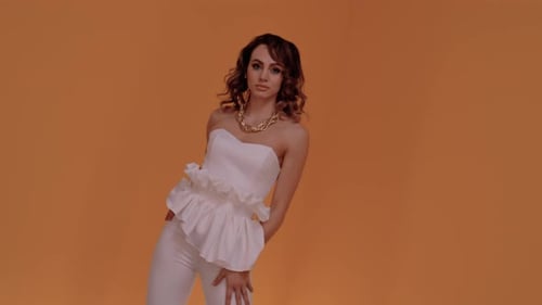 Glamorous Woman Posing in a Fashionable Outfit