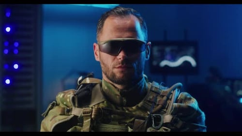 Serious Soldier in Military Gear Stares Intently