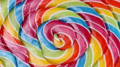 Vibrant Rainbow Lollipop Candy Rotating Close Up