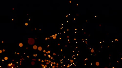 Glowing Sparks Rising on Black Background
