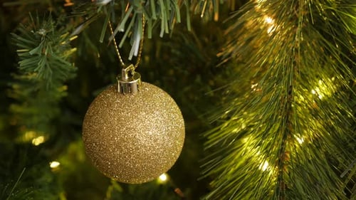 Close-up of shiny sequins on round ornament 4K 2160p 30fps UltraHD footage - Golden decorative baubl