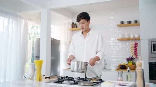 Man Preparing Food in a Modern Kitchen