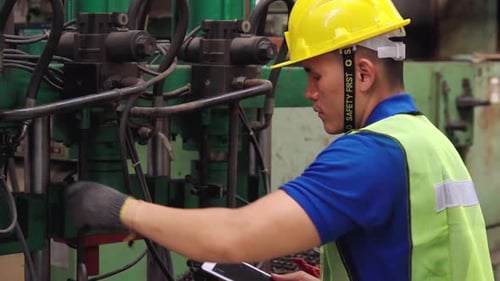 Smart Factory Worker Using Machine in Factory Workshop