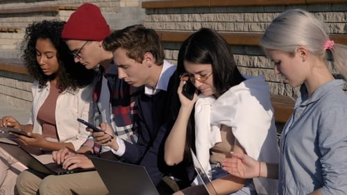 Diverse Group of Young Adults Working on Laptops