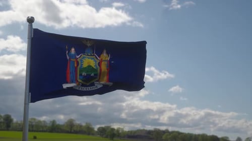 New York State Flag Waving on a Clear Day