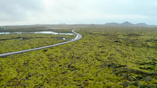 Winding Road At The Rugged Landscape Going To The Blue Lagoon In Reykjanes Peninsula, Iceland.