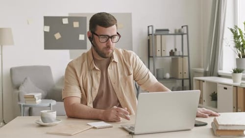 Man Working Remotely, Online Conference, Laptop, Desk