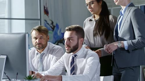 Focused Team Collaborating in Bright Modern Office