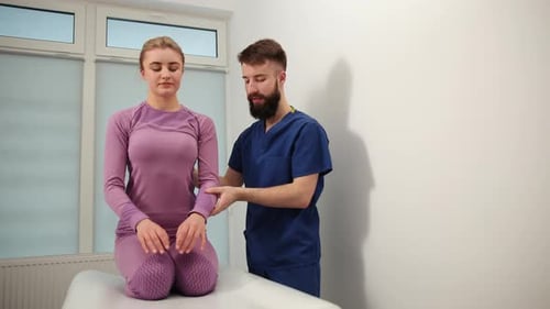 Doctor Examines Patient in Clinic