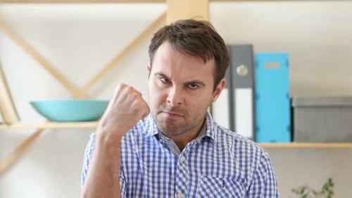 Frustrated Angry Man Yelling Sitting in Office