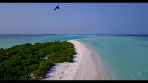 Aerial top view travel of tranquil resort beach break by blue green lagoon with white sand backgroun