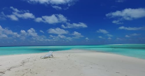 Wide angle birds eye copy space shot of a white sand paradise beach and aqua turquoise water backgro