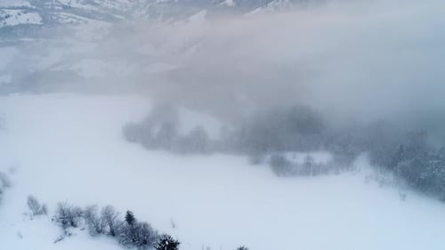 Aerial View in Foggy Sunset Winter Mountain