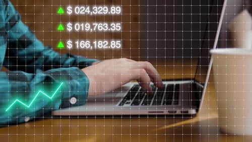 Typing on Laptop with Financial Growth Chart Overlay