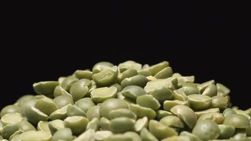 Macro Shot Of Falling Of Dried Green Peas On A Heap