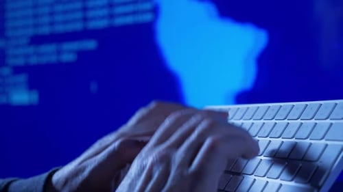 Close Up of Hands Typing Code at Night