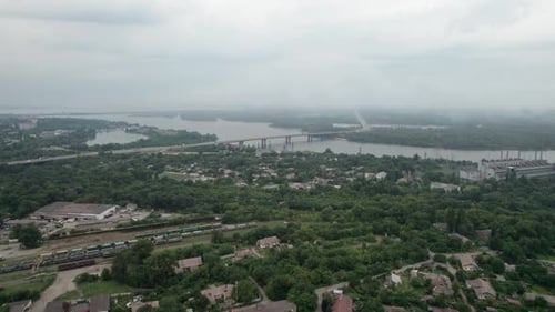 Aerial View of a Small Town Urban Landscape Flying By Houses Near Green Spaces