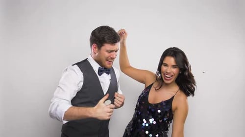 Festive Couple Celebrates with Confetti