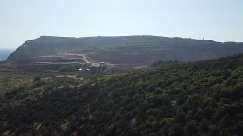 Aerial View of Industrial Opencast Mining Quarry with Lots of Machinery at Work Extracting Fluxes