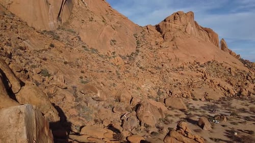 Stunning footage of a rocky mountain in a desert of Namibia, aerial shot