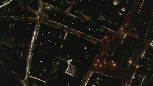 AERIAL: Slow Overhead Shot of City at Night with Lights and Traffic, Cologne, Germany