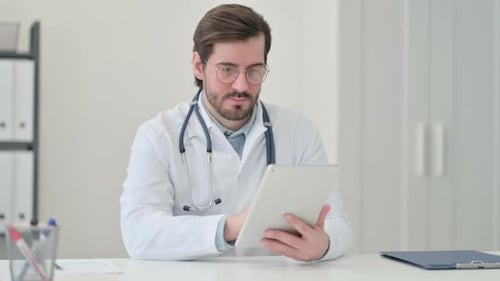 Doctor Using Tablet in Bright Office Setting