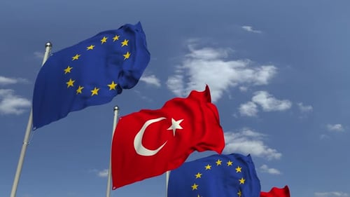 Turkey and European Union Flags Waving in Blue Sky