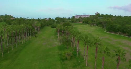 Aerial View. Golf Course with Green Field in the Valley. Green Turf Scenery.