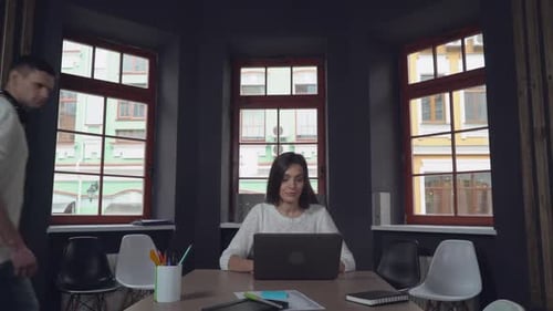 Excited Team Celebrates Business Success in Modern Office