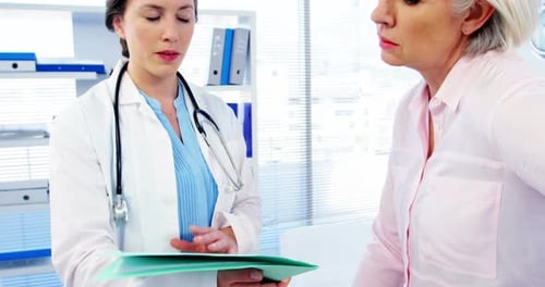 Doctor Explains Information to Patient in Office