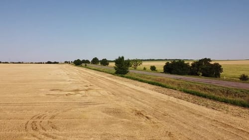 Aerial drone view of a flying over the rural agricultural landscape.