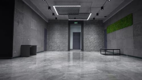 Modern Lobby with Gray Stone Walls and Reflective Floor