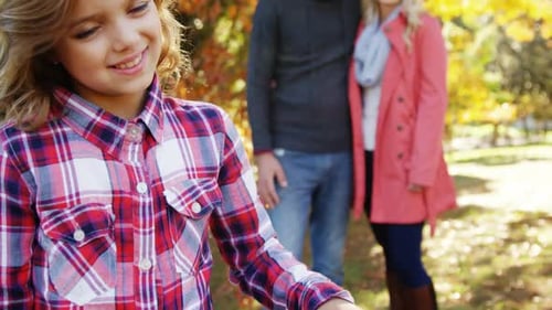 Happy Family with Dog in Autumn Park