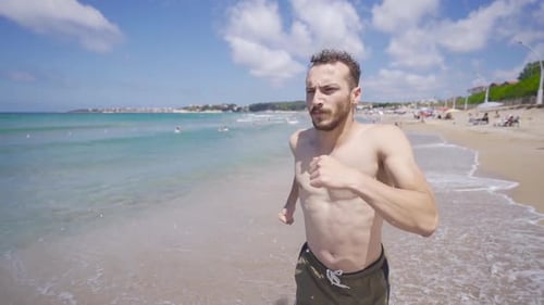 Running on the beach slow motion.