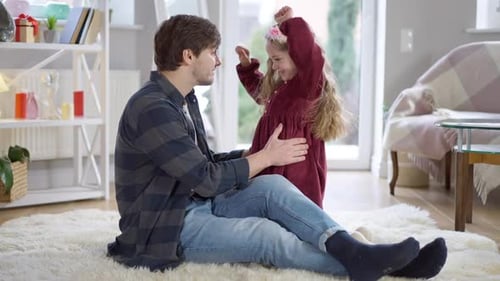 Loving Father and Daughter Embrace Indoors