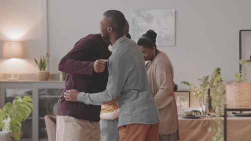 Black Men Hugging on Family Gathering
