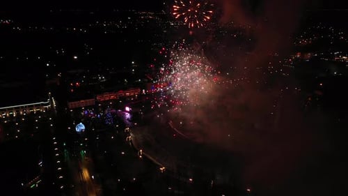 Dazzling Fireworks Display Over City at Night