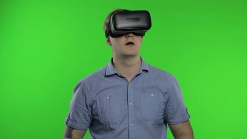 Man Using VR Headset Helmet To Play Game. Watching Virtual Reality 3d 360 Video. Chroma Key