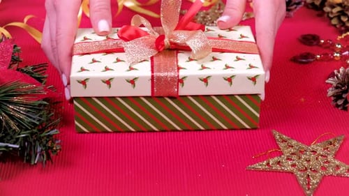 Close Up Woman Hand and Decorate Christmas Gift Box.