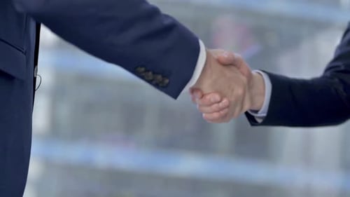 Businessmen Shaking Hands in the Workplace