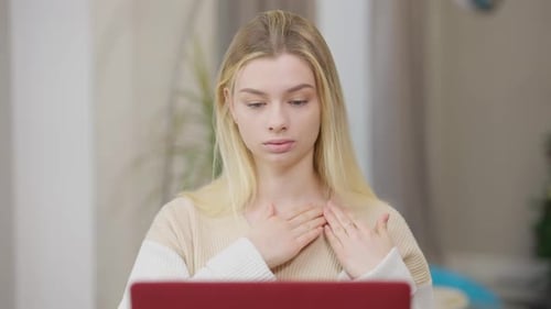 Woman Communicating Via Sign Language on Laptop