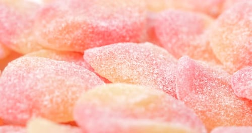 Close Up of Pink and Yellow Sugar Candies