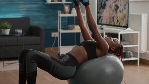 Woman Strength Training at Home with Dumbbells