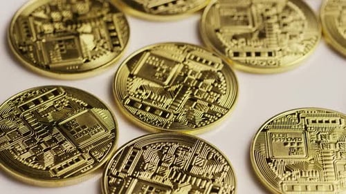 Rotating shot of Bitcoins (digital cryptocurrency) - BITCOIN