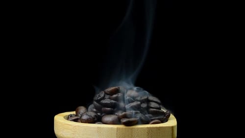 Steaming Coffee Beans in Wooden Bowl