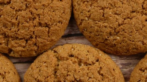 Delicious Brown Cookies on Rustic Wooden Surface