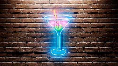 Neon in the shape of a drink. Shiny nightclub, pub or bar decoration. Party time