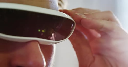 Young Adult Wearing Futuristic Smart Glasses Close Up